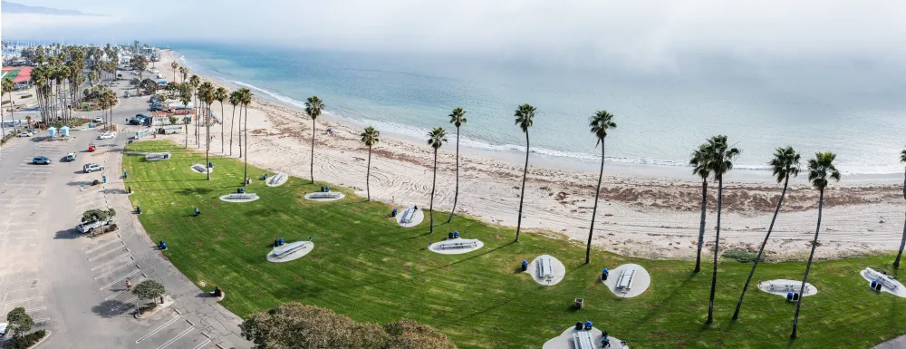 Aerial view of Leadbetter Beach Park, showcasing its stunning location next to the Santa Barbara Harbor and Shoreline Park.